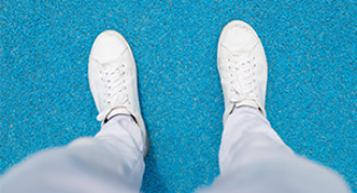 Immagine di Person's feet, wearing white shoes